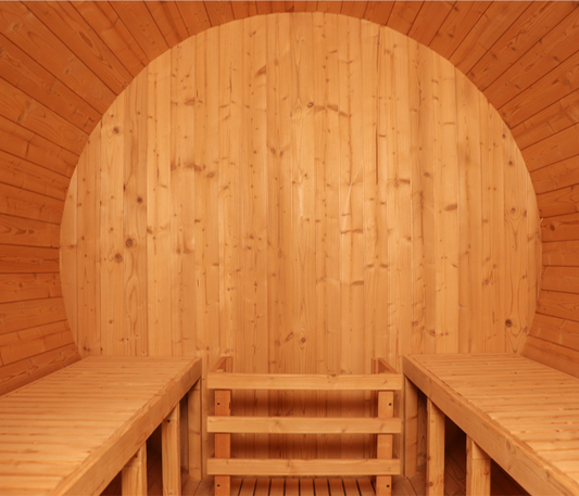 Why is it necessary to use specific types of solid wood materials for outdoor saunas?